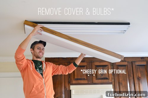 John removing fluorescent light plastic cover