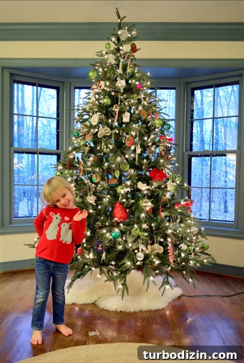 child-posing-tree