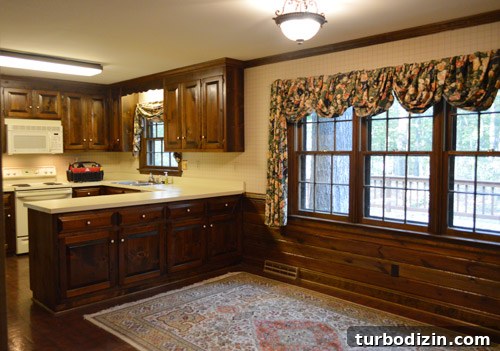 How We Installed Ikea Floating Shelves in Our Kitchen 19 before photo of dated 1980s kitchen with dark wood cabinets