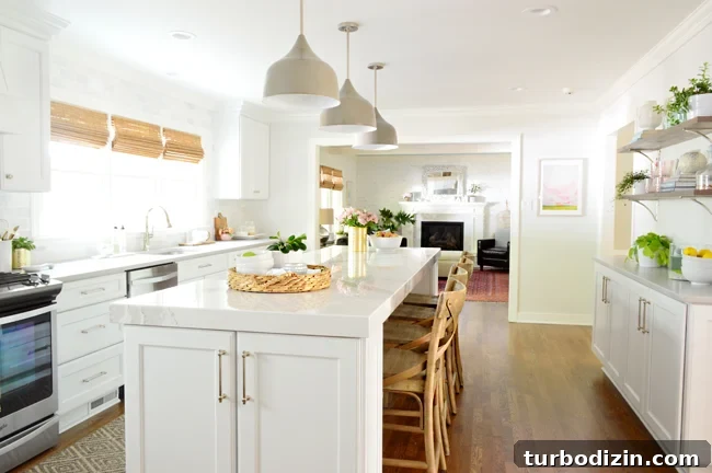 How to Make Wood Cabinets Darker: Step-by-Step Staining Guide 15 Fully renovated kitchen with new white cabinets and oversized kitchen island