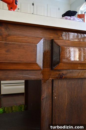 How to Make Wood Cabinets Darker: Step-by-Step Staining Guide 8 First coat of darker PolyShades stain on wood cabinet frames