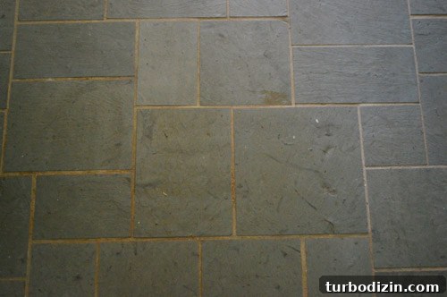 How We Restored Stained Grout to Bright White Again 4 old discolored dirty grout lines on slate tile entryway floor