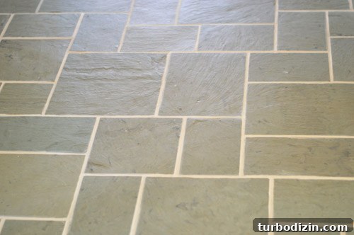 How We Restored Stained Grout to Bright White Again 5 close up of clean grout between slate tile floor after Polyblend Grout Renew application