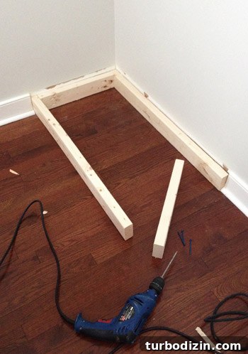 2x4 boards under base of Ikea Dresser