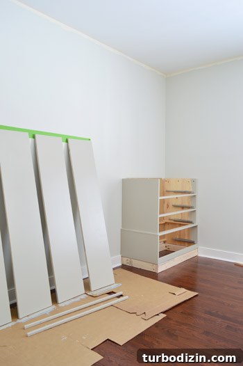 Painted pieces of Ikea Fjell dresser waiting to dry