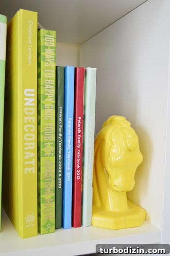 Stack of Family Yearbook Photo Books on Shelf