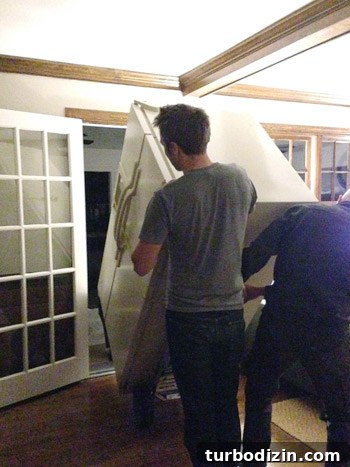 How to Paint a Refrigerator with Appliance Paint: Step-by-Step Guide 5 rolling refrigerator through backdoor of house