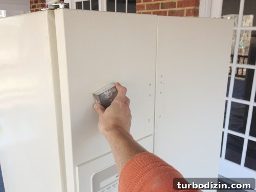 How to Paint a Refrigerator with Appliance Paint: Step-by-Step Guide 9 sanding fridge in preparation for paint