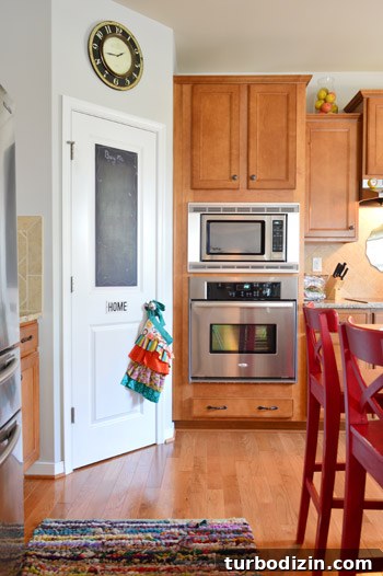 House Crashing: Joyful and Carefree Party Crashers 7 Kitchen With Wood Cabinets And Corner Pantry With Chalkboard Door