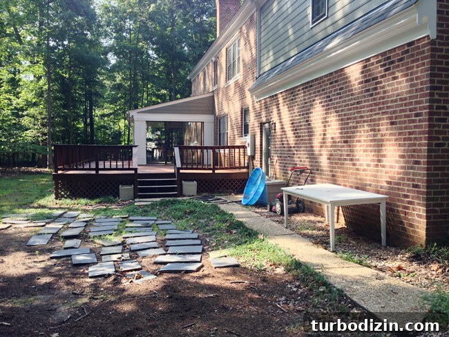 How to Paint a Garage Door and Outdoor Utility Box 9 Before Photo of Backyard Area With Messy Unorganized Items After Move In