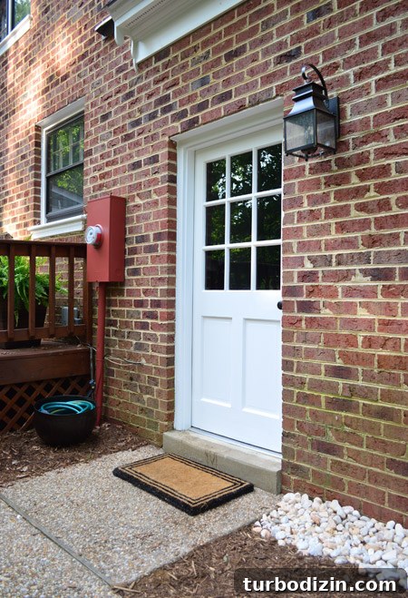 How to Paint a Garage Door and Outdoor Utility Box 7 Close Up Of Updated Outdoor Area With Painted Door New Light And Disguised Electrical Box