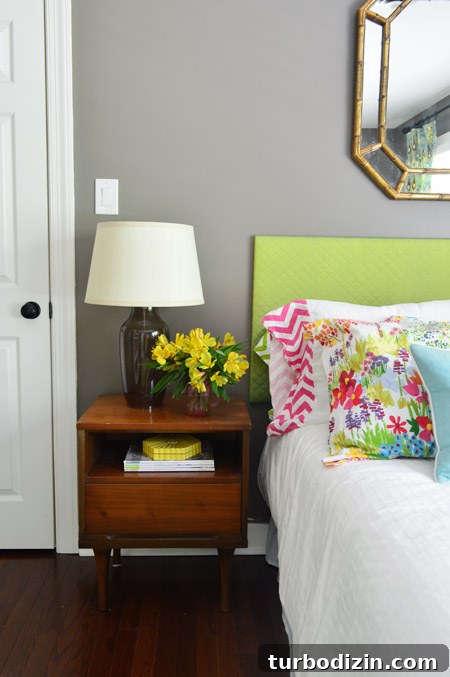 Our Top Pick for a Cozy Bedroom Paint Color 10 Side table in bedroom with colorful flowers and headboard