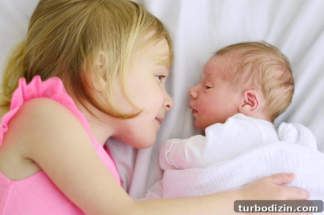 Newborn Photography: A Simple Guide to Shooting Your Baby at Home 15 Big Sister And Baby Brother Side-By-Side In Bed