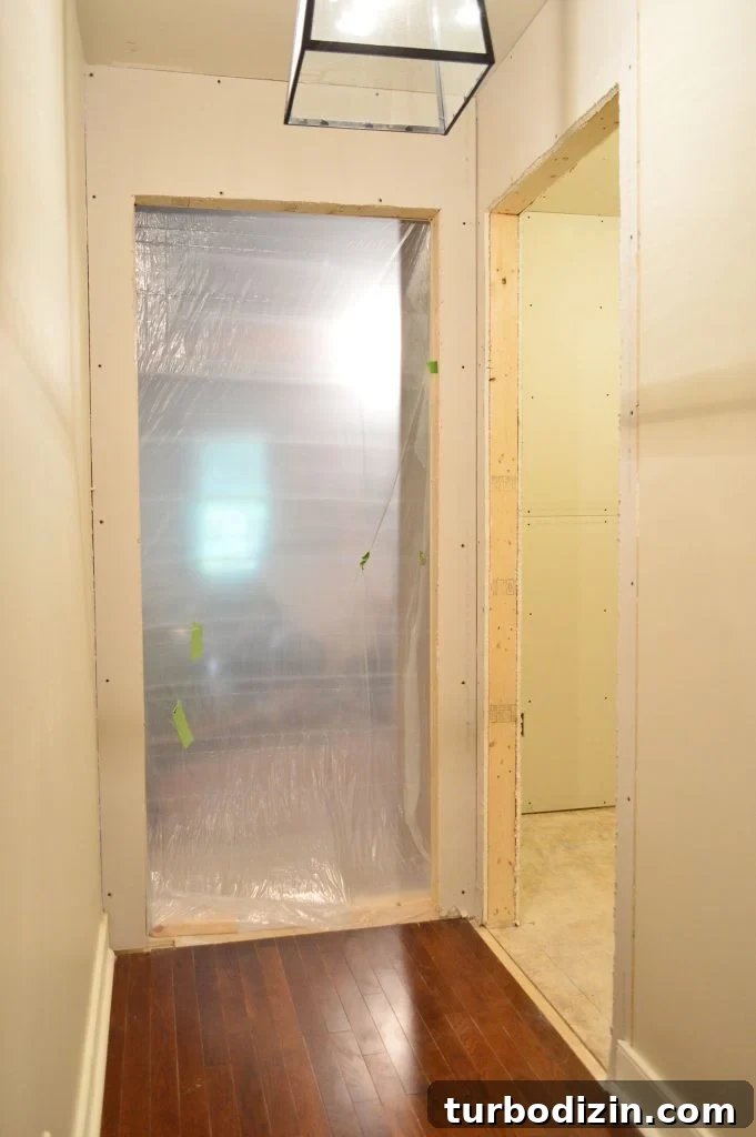 How to Hang Drywall Solo: A Step-by-Step Guide for DIYers 17 two doorways drywalled and openings cut