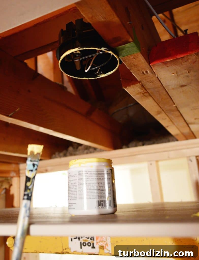 How to Hang Drywall Solo: A Step-by-Step Guide for DIYers 9 light fixture box in ceiling marked with yellow paint