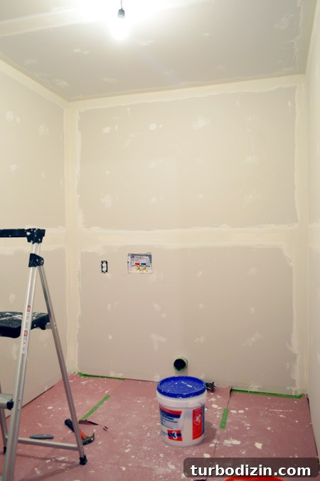Drywall Taping, Mudding, and Sanding: Step-by-Step Guide 20 small room with one coat of drywall tape and mud applied