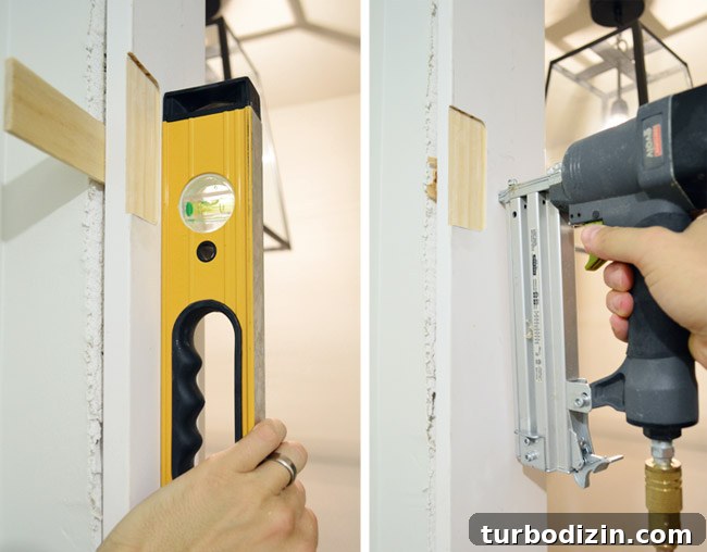 How to Hang a Door: Step-by-Step Guide for a Perfect Fit 17 Checking For Level And Nailing In DIY Door Jamb Kit Into Laundry Room Using Shims