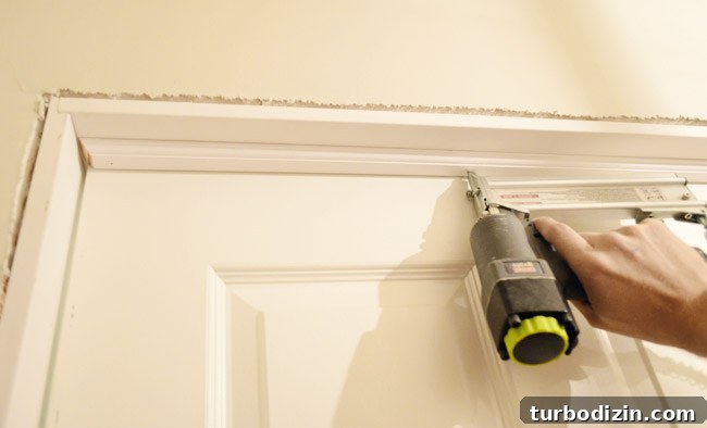 How to Hang a Door: Step-by-Step Guide for a Perfect Fit 20 Nailing In Door Stop Trim Into DIY Jamb Kit Construction With Nail Gun
