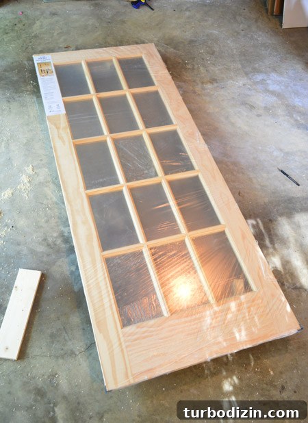How to Hang a Door: Step-by-Step Guide for a Perfect Fit 22 Unfinished 15 Pane Wood Door In Plastic Wrap For Bonus Room Entrance