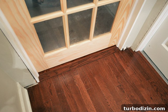 How to Hang a Door: Step-by-Step Guide for a Perfect Fit 35 View Of Flooring Under Two Doors With Hardwood Threshold And Tile
