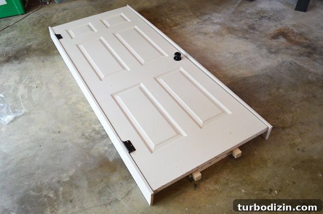 How to Hang a Door: Step-by-Step Guide for a Perfect Fit 8 Paneled Door Loosely Fit In Layout Of DIY Door Jamb On Garage Floor