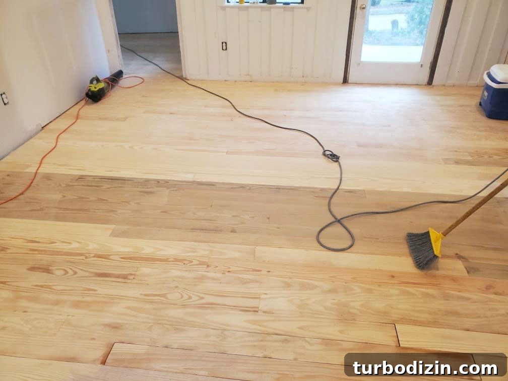 How to Refinish Hardwood Floors: Step-by-Step Guide 17 Bare sanded oak floors in beach house