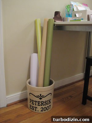 Create a Stylish Craft Space and Gift-Wrapping Station 4 Planter holding wrapping paper