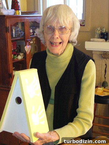 Granny holding the birdhouse