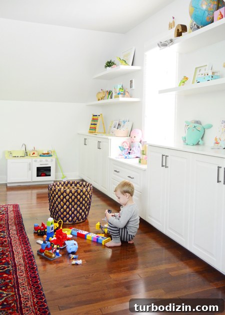 How We Transformed Our Bonus Room Into a Stylish Lounge 13 Playful-Family-Bonus-Room-Shelves-Legos-Playing