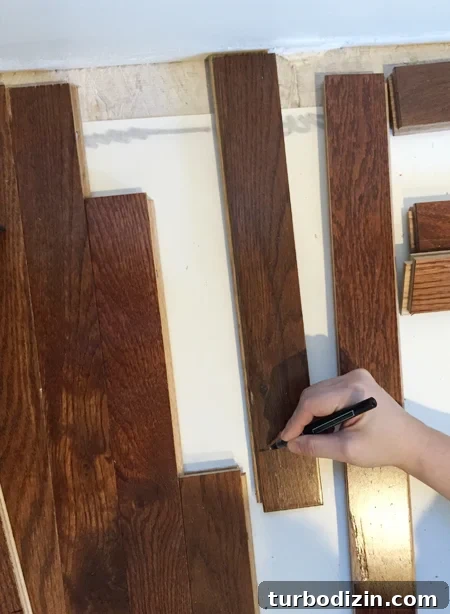 Install Hardwood Flooring: Step-by-Step Guide for DIY Success 10 install hardwood flooring marking boards to cut