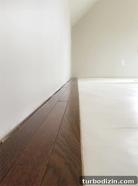 Install Hardwood Flooring: Step-by-Step Guide for DIY Success 7 install hardwood flooring first rows done