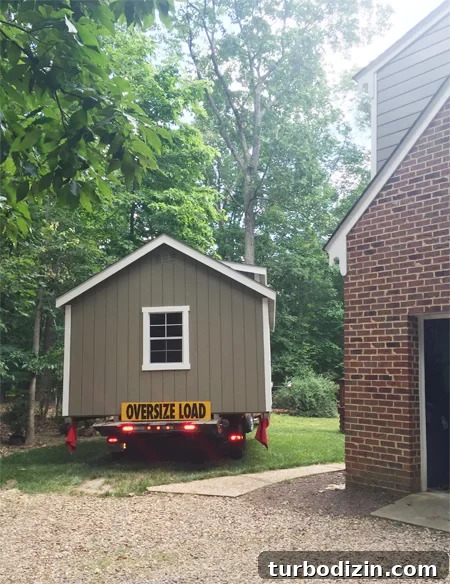 Shed-Delivery-Driving-Around-Back-Wide-Load