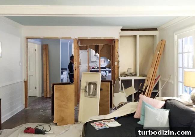 kitchen-demo-wall-coming-down-fireplace