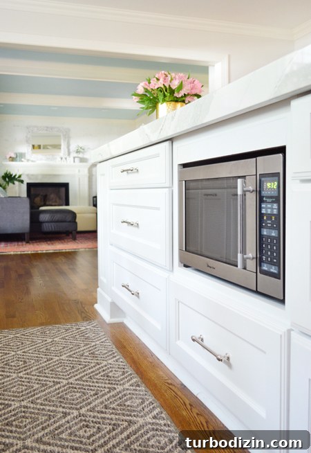 white-kitchen-remodel-final-microwave-with-living-room