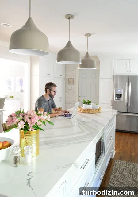 white-kitchen-remodel-john-working-at-island
