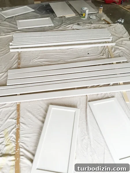 How to Build Custom Built-In Bookshelves for Your Home 12 Painted wood pieces drying for bookshelf project