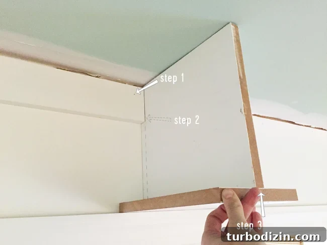 How to Build Custom Built-In Bookshelves for Your Home 15 Attaching header piece to secure bookshelf across doorway