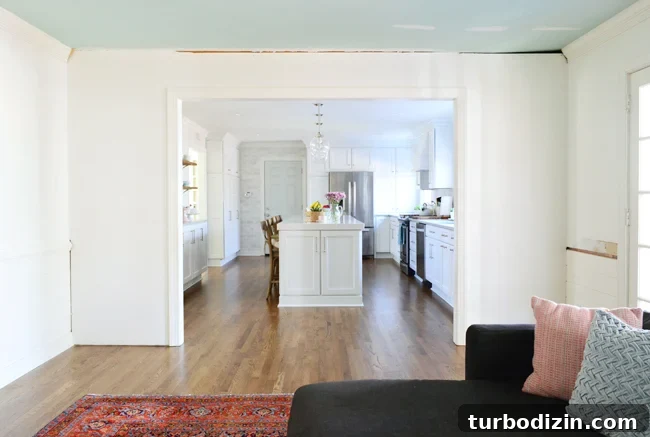 How to Build Custom Built-In Bookshelves for Your Home 5 Before photo of wall where built-in bookshelf will go around doorway