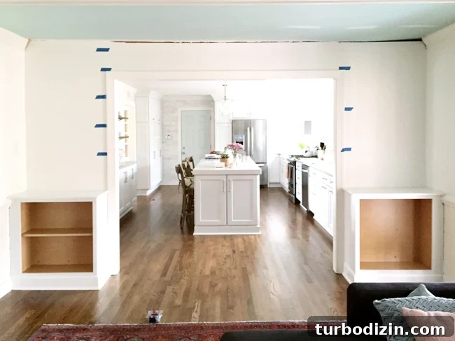 How to Build Custom Built-In Bookshelves for Your Home 7 Painters Tape On Wall To Determine Spacing of DIY built-in bookshelves
