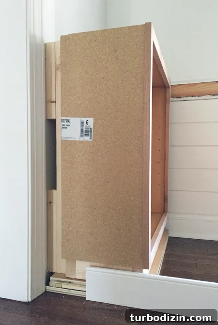 How to Build Custom Built-In Bookshelves for Your Home 9 Blocking behind base cabinet for built-in bookshelf