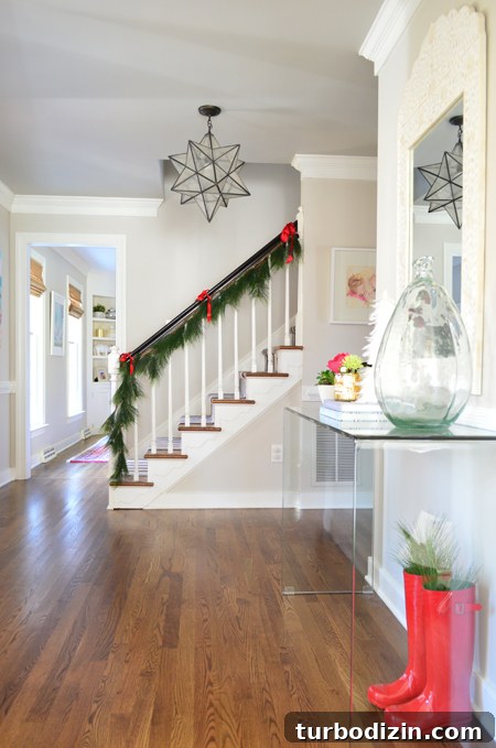 Holiday Home Tour: Step Inside Our Festive Christmas Tree Display 14 xmas-decor-foyer-console-with-stairs