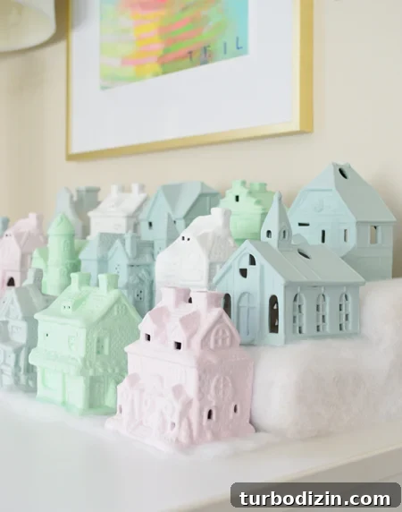 How to Paint a Festive Christmas Village House for Your Display 9 miniature Christmas village set in pastel colors