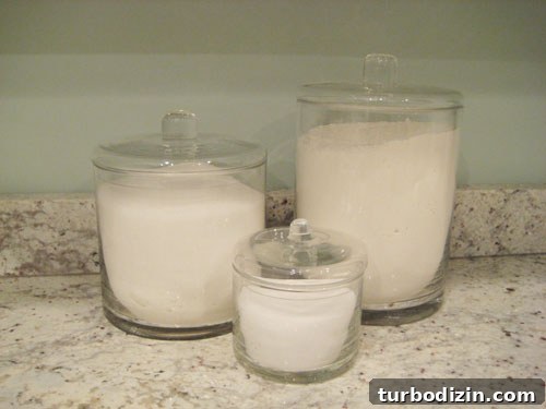 White-Hot Trends: What’s Driving the White Color Craze in 2026 4 Glass canisters filled with white pantry items