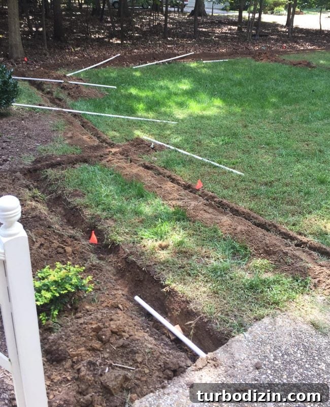 install irrigation system laying pvc pipe along trenches