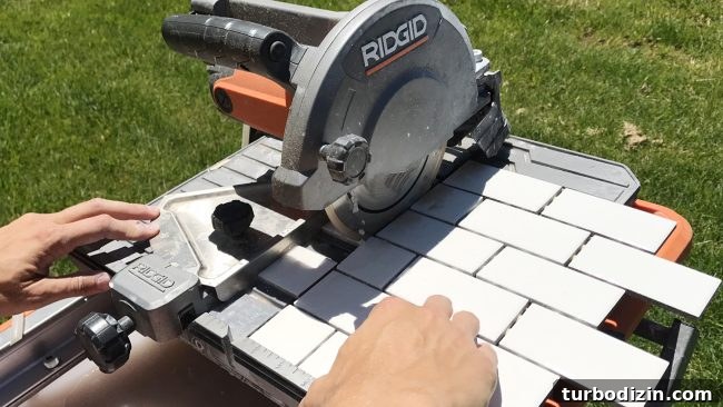 Install a Subway Tile Kitchen Backsplash for $200 DIY Guide 11 Ridgid wet saw cutting a sheet of small white subway tiles