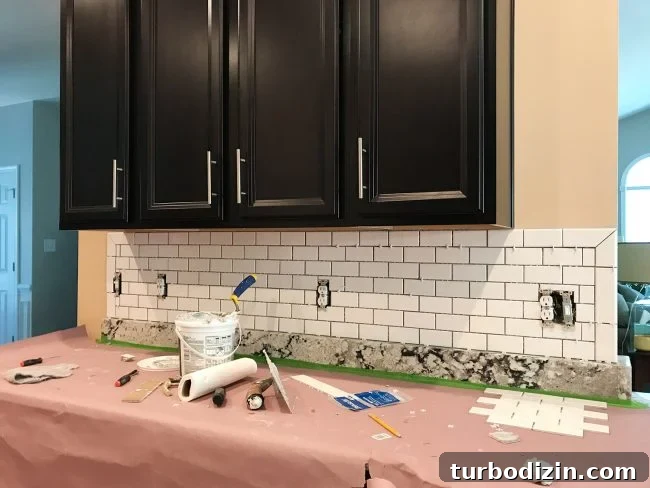 Install a Subway Tile Kitchen Backsplash for $200 DIY Guide 13 ungrouted white subway tile backsplash with bullnose edges