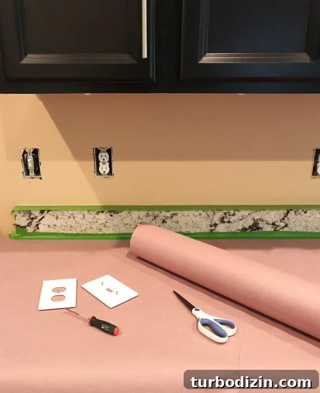 Install a Subway Tile Kitchen Backsplash for $200 DIY Guide 5 kitchen prepared for tiling with outlet covers removed and counters protected