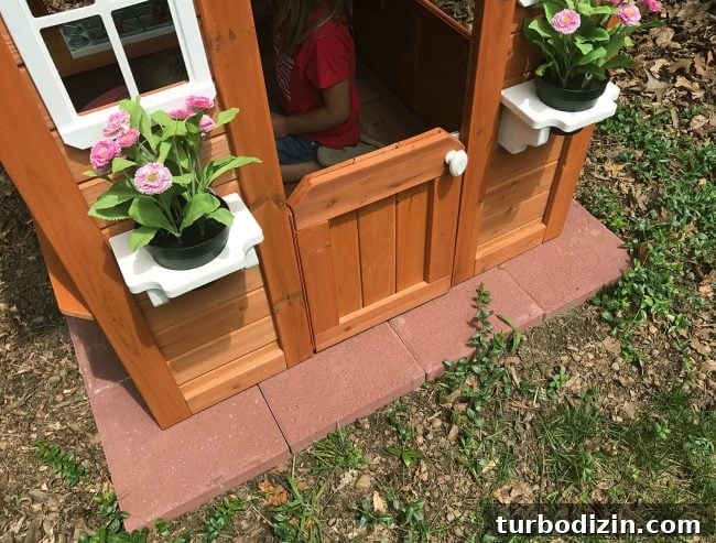 backyard discoveries cedar wooden playhouse with red paver base