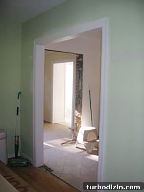 How to Widen a Brick Doorway: Hiring a Mason Guide 3 View from living room showing open connections to kitchen and den