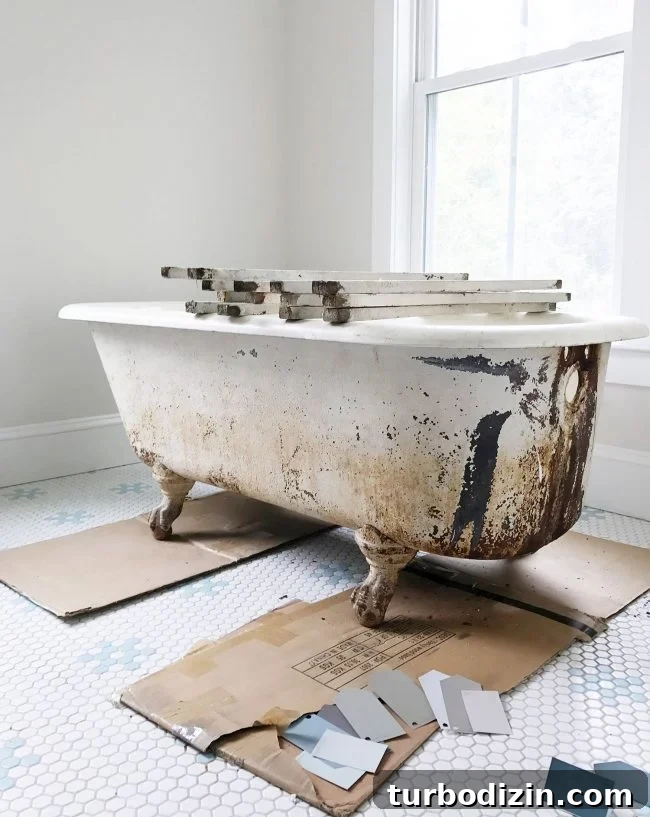 Dirty outside of clawfoot tub with rust stains